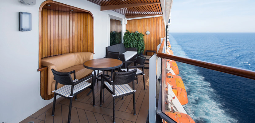 a table and chairs on a deck