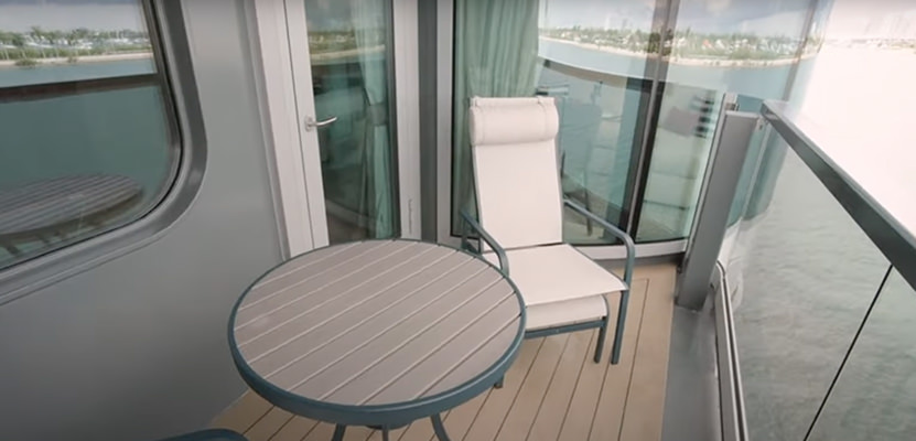 a chair and a table on a deck